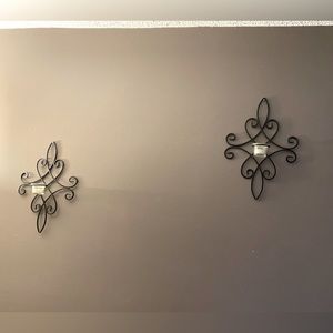 Pair of black metal sconces w candle holder. Approx. 16” H x 11” W.